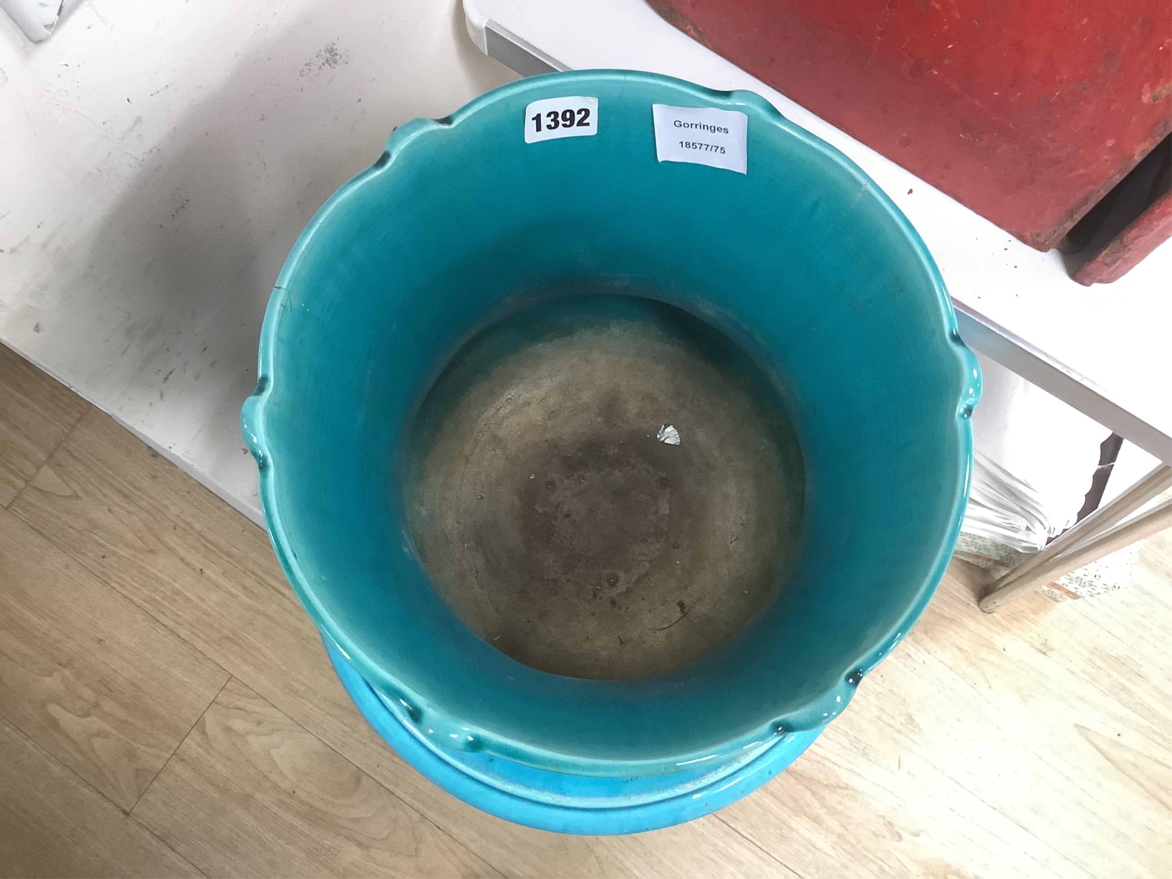 A Burmantofts style turquoise glazed jardiniere and a similar larger stand, decorated in relief, 90cm high